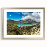 Abstract art print of an Ethiopian landscape in muted earth tones, framed in silver, suitable for dining room decor.