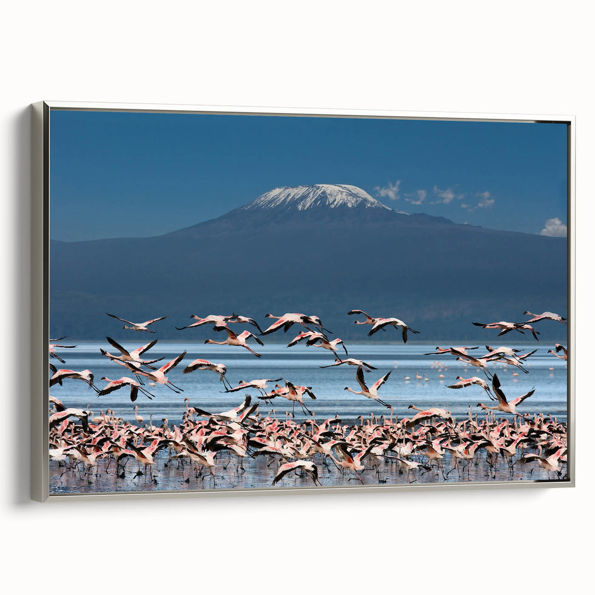 Vintage poster art of a Kenyan landscape on a framed canvas, featuring colorful art with black accents.