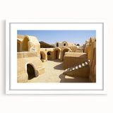 Extra large abstract art print of a Moroccan landscape in textured earth tones, framed with a white mat.