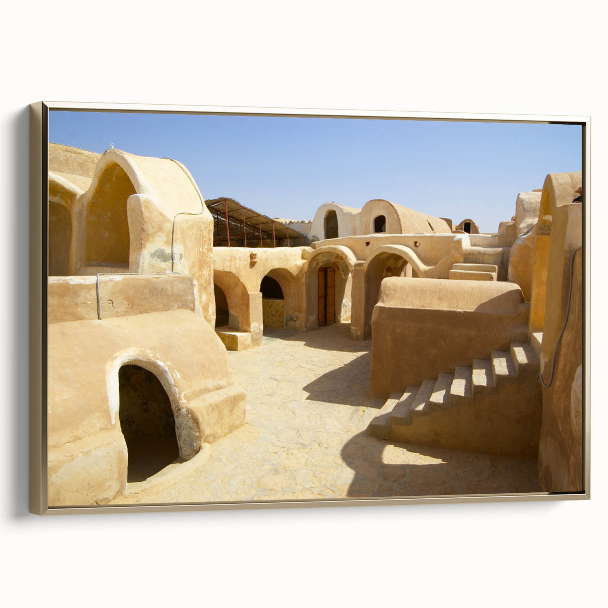 Landscape art painting of a Moroccan scene on framed canvas, featuring a colorful palette with gold accents.