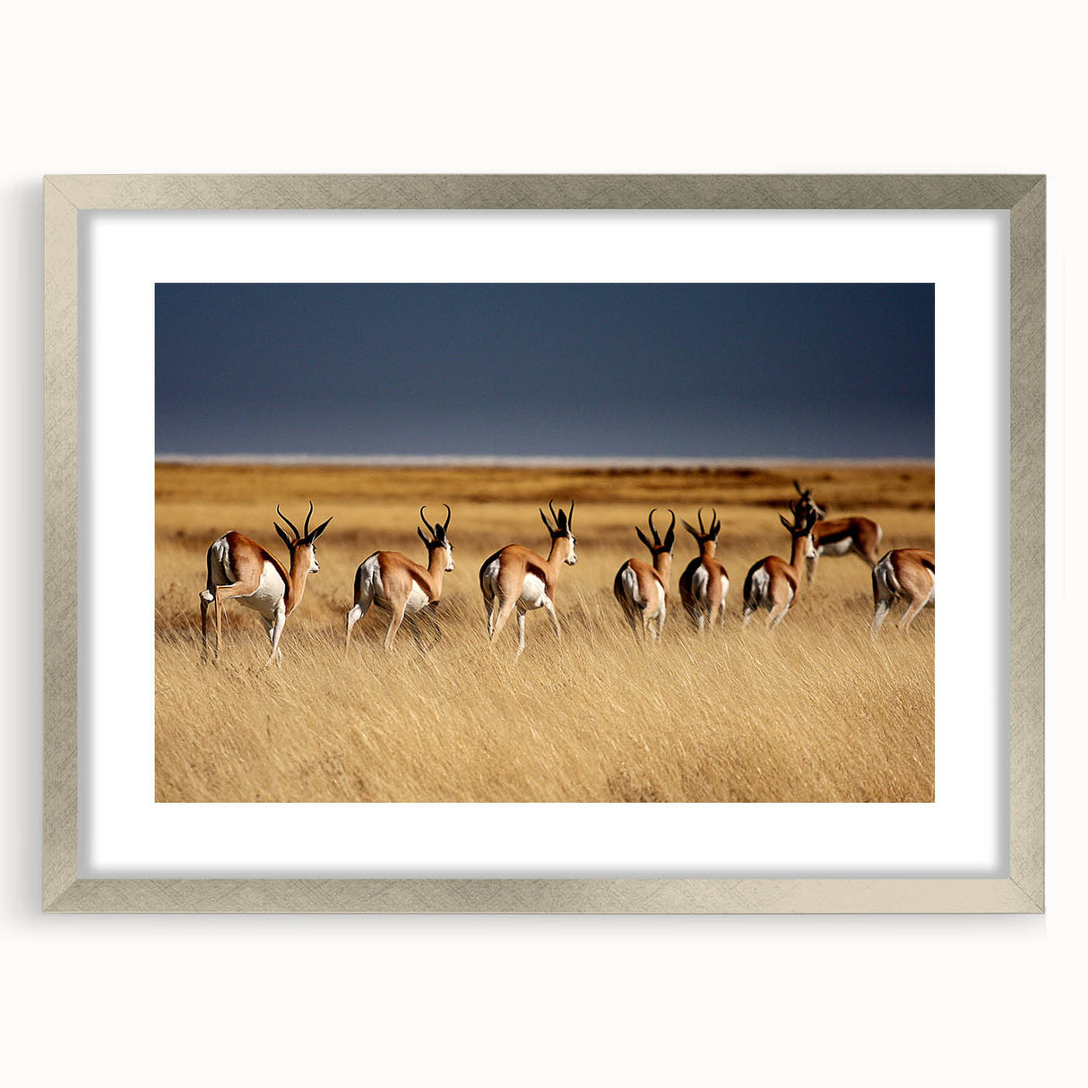 Textured art print of an abstract Namibian landscape in earth tones, framed in silver, ideal for bedroom art.
