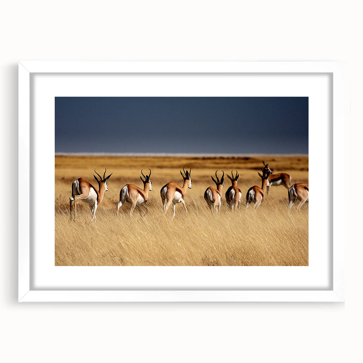 Abstract art print of Namibian landscape in muted earth tones on a white-framed canvas, ideal for dining room decor.