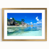 Abstract art print of Seychelles scenery in muted blue and green tones on a framed canvas, suitable for dining room decor.