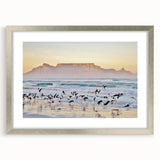 Textured art print of an abstract African landscape in muted earth tones, framed in silver, ideal for bedroom decor.