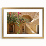 Abstract art print of a Tunisian landscape in muted earth tones on a framed gold mat, suitable for dining room decor.