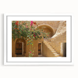 Textured abstract art print of a Tunisian landscape in muted earth tones on a framed white mat, suitable for bedroom art.