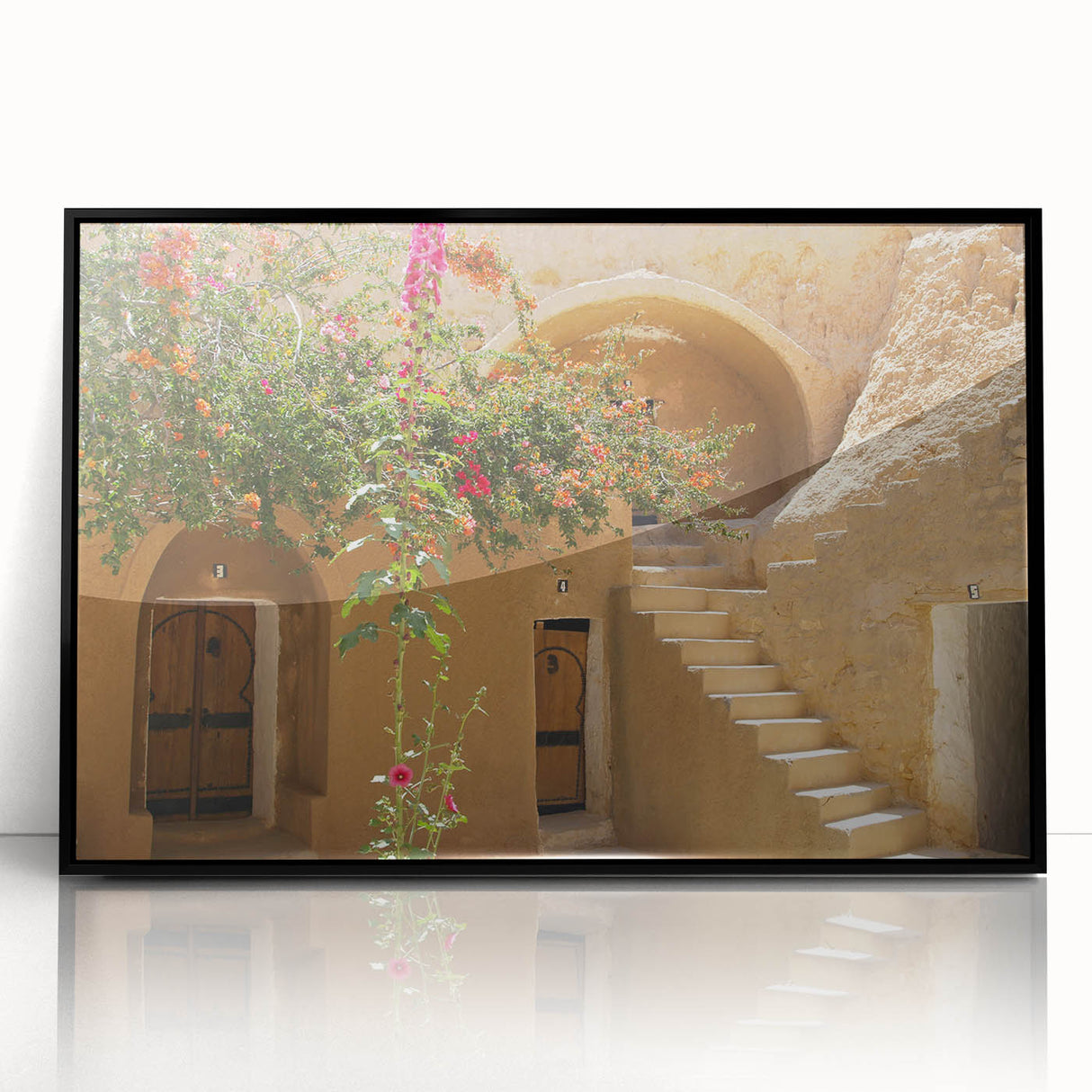Large abstract wall art featuring a Tunisian landscape in muted earth tones, framed in black acrylic.