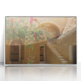 Framed acrylic print of a Tunisian landscape in art deco style, featuring soft earth tones, ideal for modern nursery decor.