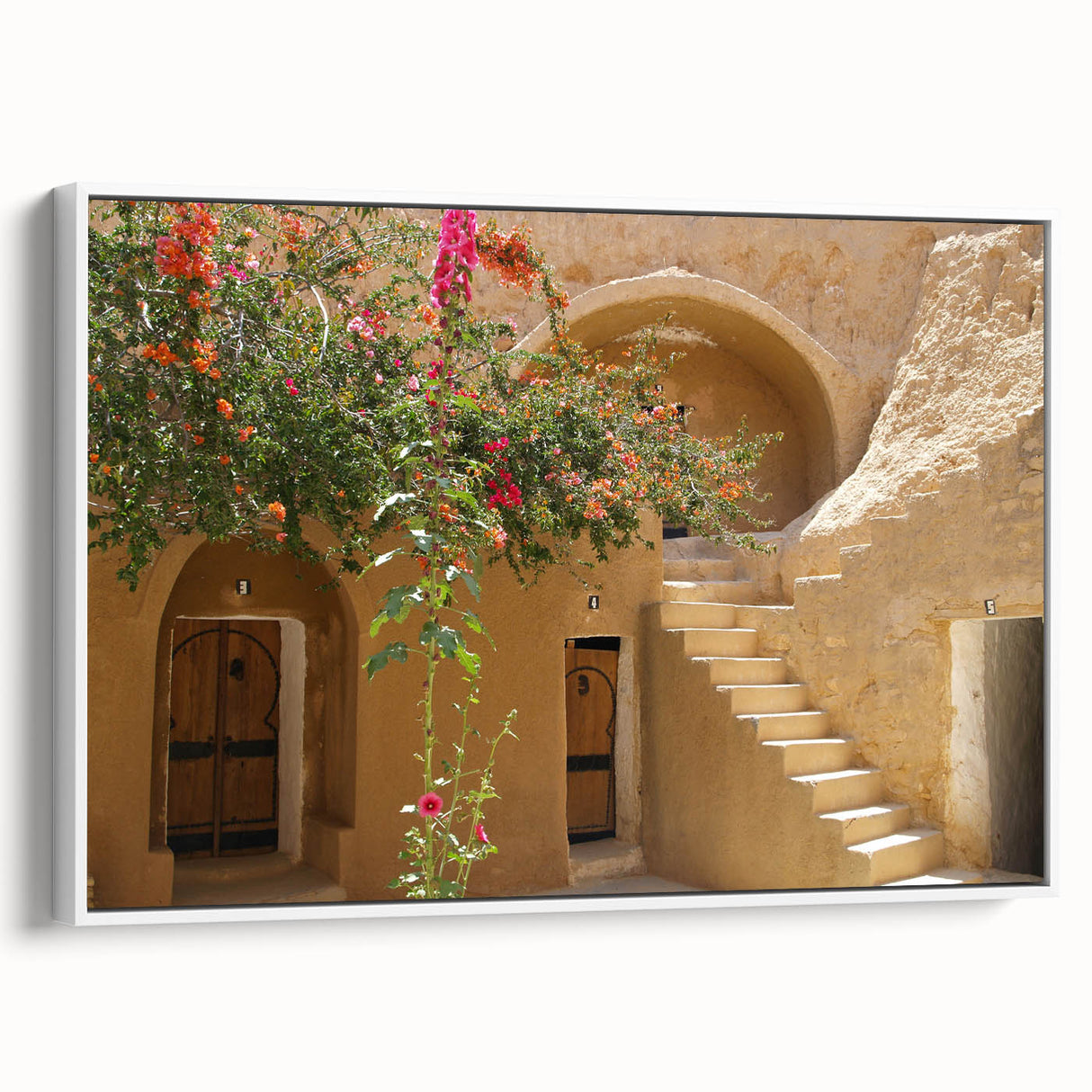 Vintage poster art of a Tunisian landscape on framed canvas, featuring vibrant colors, ideal for living room decor.