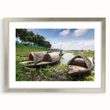 Textured art featuring an abstract depiction of a Bangladeshi landscape in muted earth tones, presented in a silver frame.