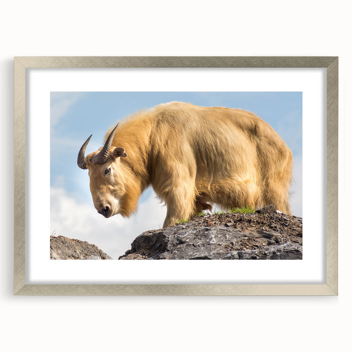 Textured art print depicting a serene Bhutanese landscape in muted earth tones, framed in silver, ideal for bedroom art.