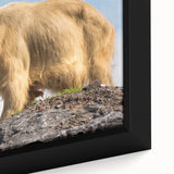 Framed canvas of a Bhutanese landscape in black with colorful, textured elements, ideal for living room decor.