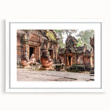 Abstract art print of a Cambodian landscape in muted green and blue tones, framed with a white mat.