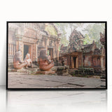Large abstract wall art depicting a Cambodian landscape in muted earth tones, framed in black acrylic.