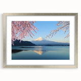 Textured art print of Mount Fuji in abstract style with muted blue and white tones, framed in silver, ideal for bedroom art.