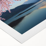 Art deco poster of Mount Fuji with muted blue and gray hues on rolled canvas, suitable for dining room wall art.