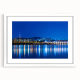 Abstract art print of Seoul skyline in muted gray and blue tones, framed with a white mat, suitable for dining room decor.