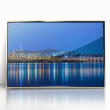 Mid-century modernist art depicting Seoul's skyline in muted blue and silver tones, acrylic print framed.