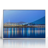 Acrylic print of Seoul skyline in muted gray and blue tones, framed in white, ideal for modern art wall decor.