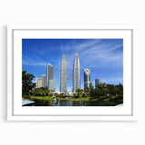 Abstract art print depicting a serene Malaysian landscape in muted earth tones, framed with a white mat.