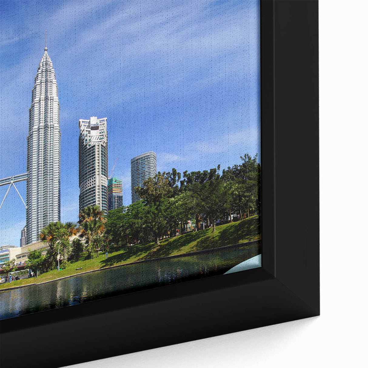 Close-up of textured black wall art featuring a vibrant Malaysian landscape on framed canvas, ideal for living room decor.