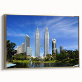 Framed canvas of a vintage-style Malaysian landscape in gold and black tones, suitable for bedroom decor.