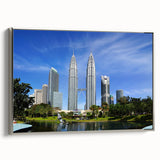 Framed canvas landscape art painting depicting a Malaysian village scene in vibrant, colorful hues.