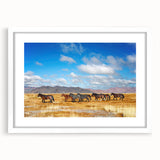 Abstract art print of a Mongolian landscape in muted earth tones on a framed canvas, ideal for dining room decor.