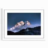 Abstract art print of Mount Everest in cool blue and white tones, framed with a white mat.