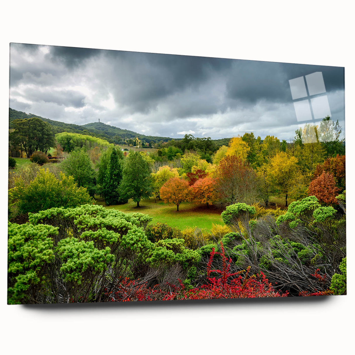 Large abstract wall art of Adelaide skyline in muted blue and green hues on acrylic glass.