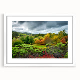 Extra large abstract art print of Adelaide scenery in textured shades of blue and green, framed with a white mat.