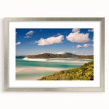 Abstract art print of the Great Barrier Reef in vibrant blue and green tones on a framed silver mat.