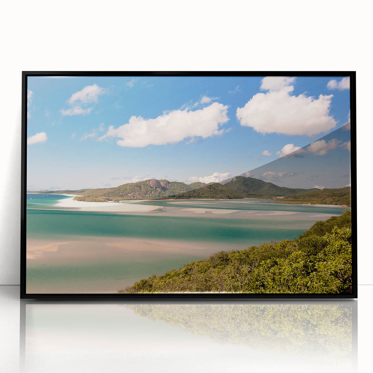 Large abstract wall art depicting the Great Barrier Reef in vibrant blue tones, framed in black acrylic.