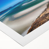 Art deco poster featuring Queensland scenery on rolled canvas with vibrant green and blue tones.