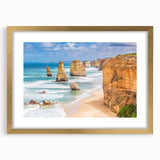 Abstract art print of Australian scenery in muted earth tones, framed in gold, suitable for bedroom or dining room decor.