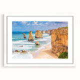 Textured abstract art print of Australian scenery in muted earth tones, framed with a white mat, suitable for bedroom decor.