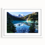 Abstract art print of British Columbia scenery in muted green and blue, framed with a white mat.