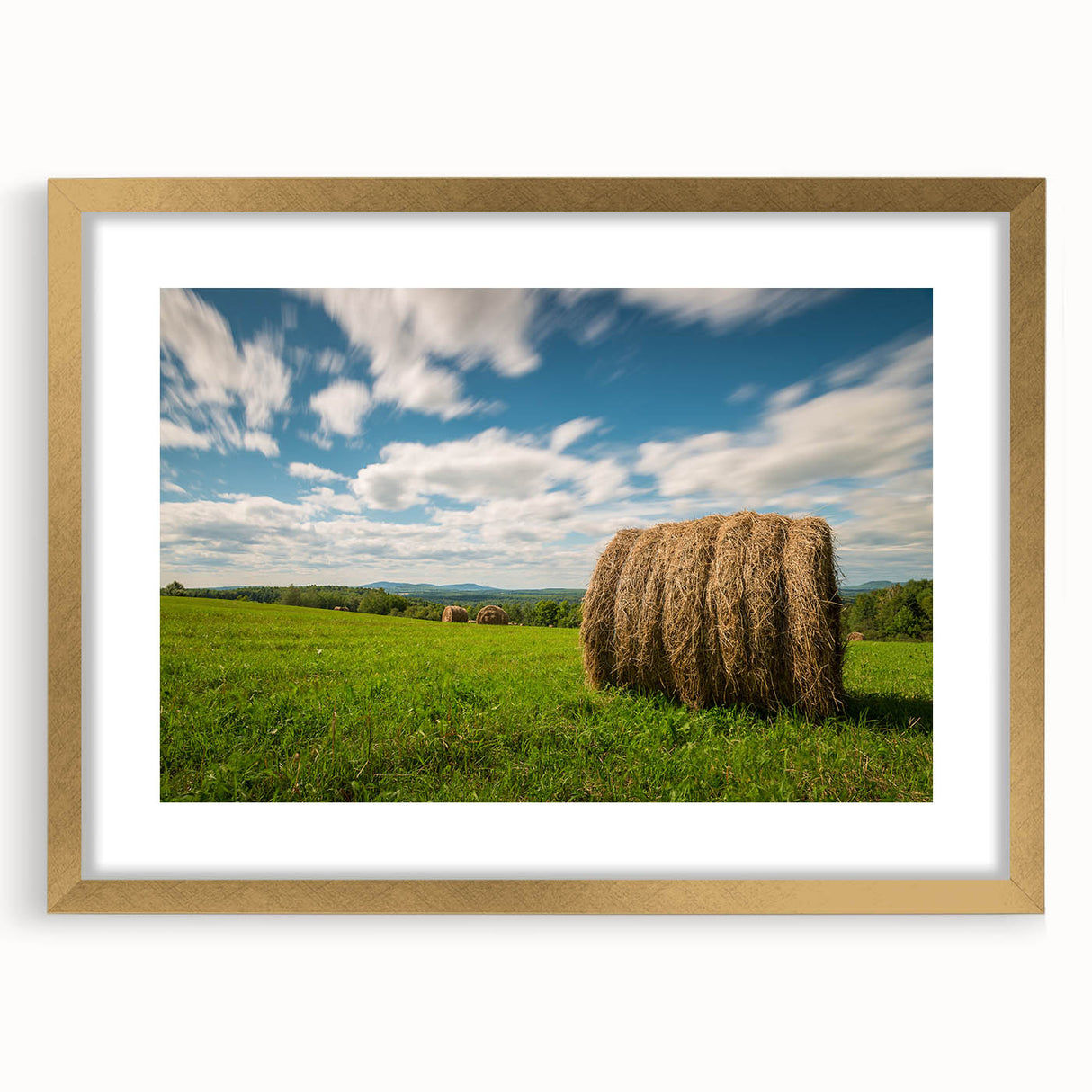 Extra large wall art featuring an abstract depiction of New Brunswick scenery in textured gold tones, framed with a mat.
