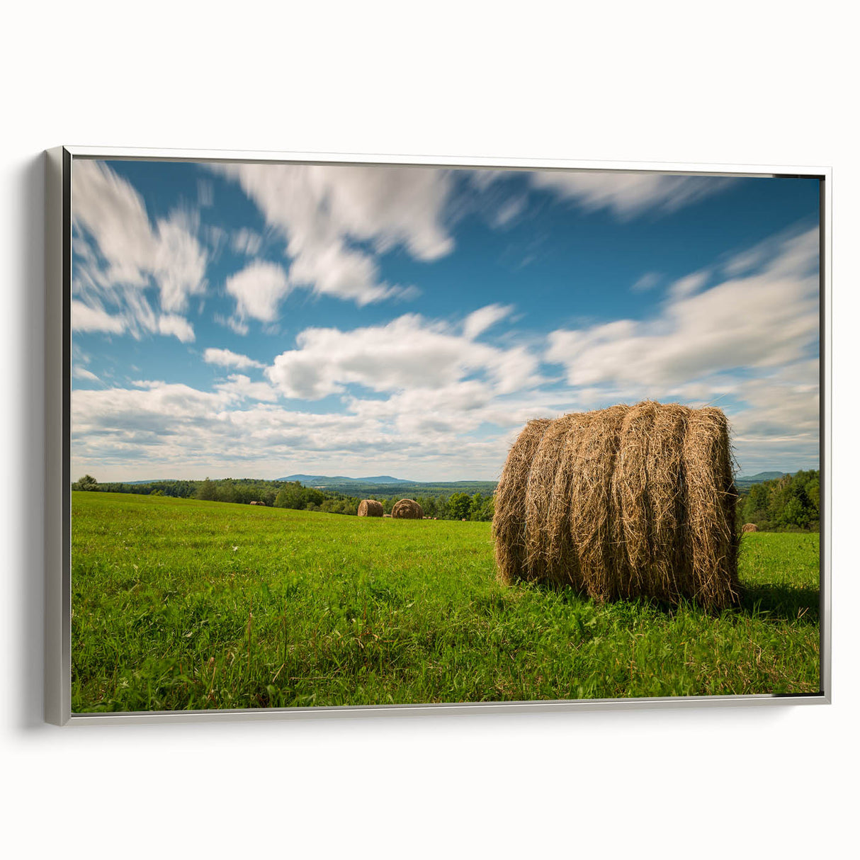Landscape art painting of New Brunswick scenery on a framed canvas, featuring vibrant green and blue tones.