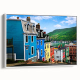 Vintage poster art of Newfoundland scenery on an extra large framed canvas, with colorful imagery against a black background.