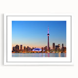 Abstract art print of a serene Ontario landscape in muted green and blue tones, framed with a white mat.