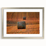 Textured abstract art print of Saskatchewan scenery in muted earth tones, framed with a silver mat.