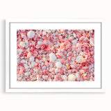 Textured abstract art print of a Caribbean scenery in muted blue and green, framed in white, suitable for bedroom decor.