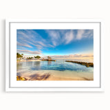 Textured abstract art print depicting a serene Caribbean seascape in muted blue and white tones, framed with a white mat.
