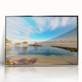 Art deco poster of a Caribbean scenery in muted blue and green tones, framed in silver acrylic.