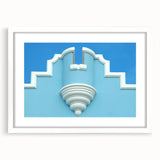 Textured abstract art print of Caribbean scenery in muted blue and green shades on a framed white mat.