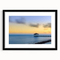 Colorful abstract art print of Caribbean scenery in a black frame, ideal for living room decor.