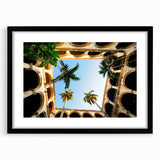 Colorful art depicting an abstract Caribbean scene in vibrant hues on a large framed canvas, ideal for living room decor.