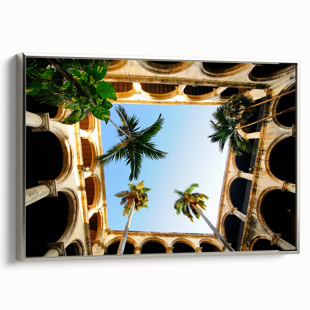Framed canvas of a vintage Caribbean landscape with vibrant colors and black accents, ideal for living room decor.