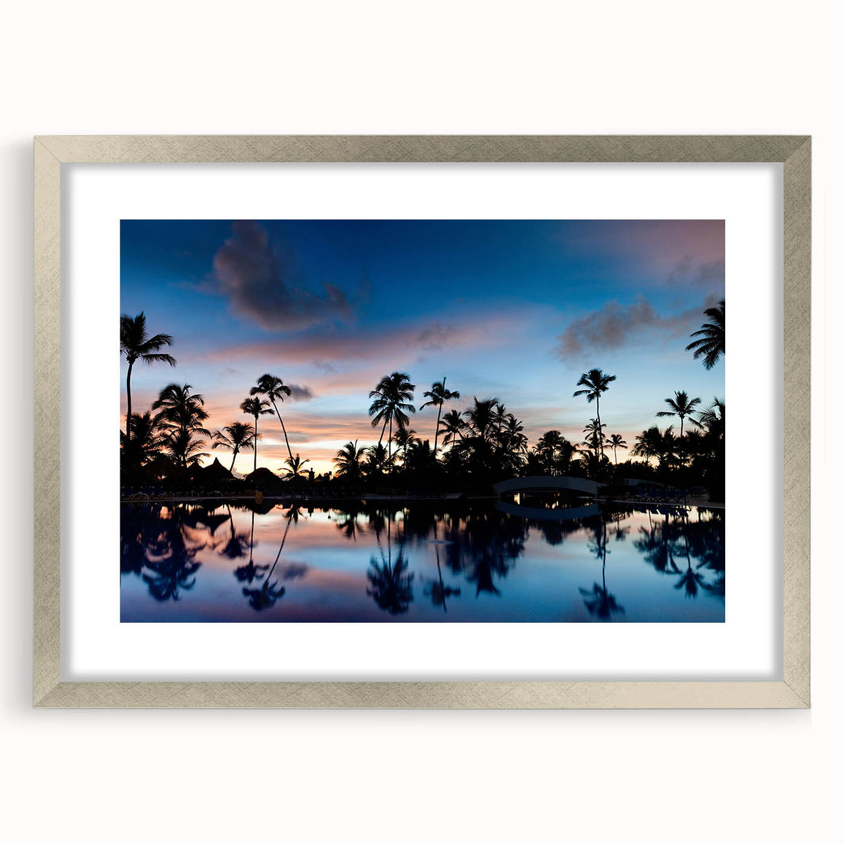 Extra large abstract art print of a Caribbean scene in vibrant blue and green tones, framed in silver.